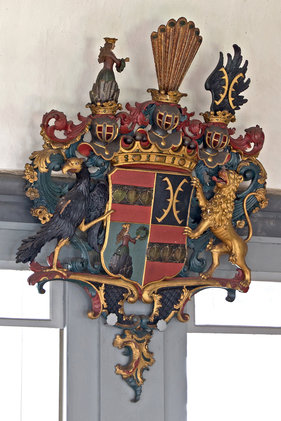 Wappen an der Kirchenwand in St. Johannis Siebeneichen