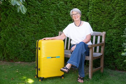 Eine Frau mit einem Koffer - Copyright: Oliver Beck 