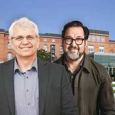 Zwei Menschen vor einem Gebäude