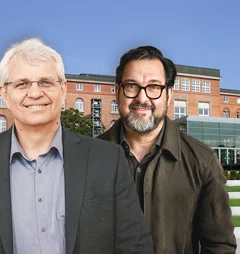 Zwei Menschen vor einem Gebäude