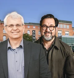 Zwei Menschen vor einem Gebäude